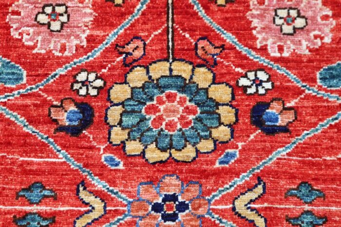 Luxury red and navy Persian rug with symmetrical medallions and intricate craftsmanship, ideal for living rooms and dining spaces