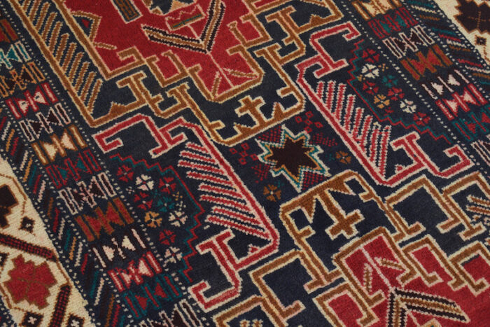 raditional handwoven rug with detailed tribal motifs in deep red, blue, and beige. Machine-washable and perfect for modern homes."