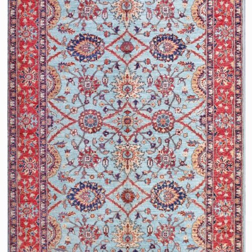 Persian-inspired wool rug in sky blue and brick red, designed for modern and traditional home decor.