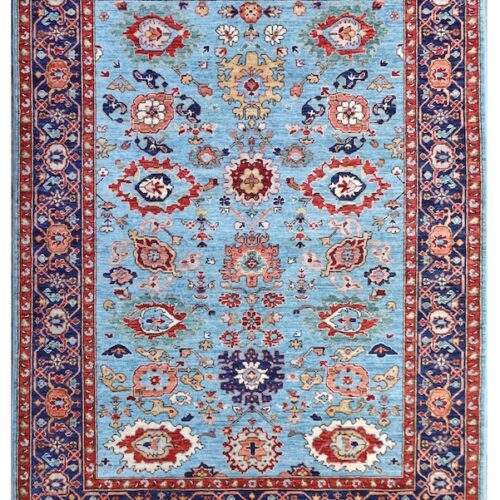 Handmade Persian Heriz rug in sky blue and warm red tones, crafted with high-quality wool and expert weaving