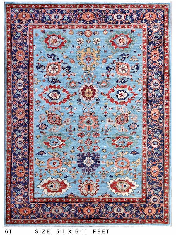 Handmade Persian Heriz rug in sky blue and warm red tones, crafted with high-quality wool and expert weaving