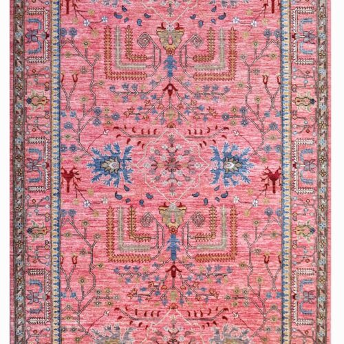 Handmade Persian Heriz rug in warm pink and blue tones, crafted with natural dyes and fine craftsmanship