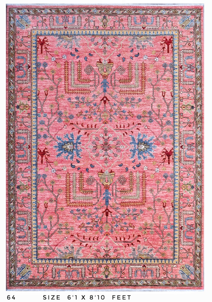 Handmade Persian Heriz rug in warm pink and blue tones, crafted with natural dyes and fine craftsmanship