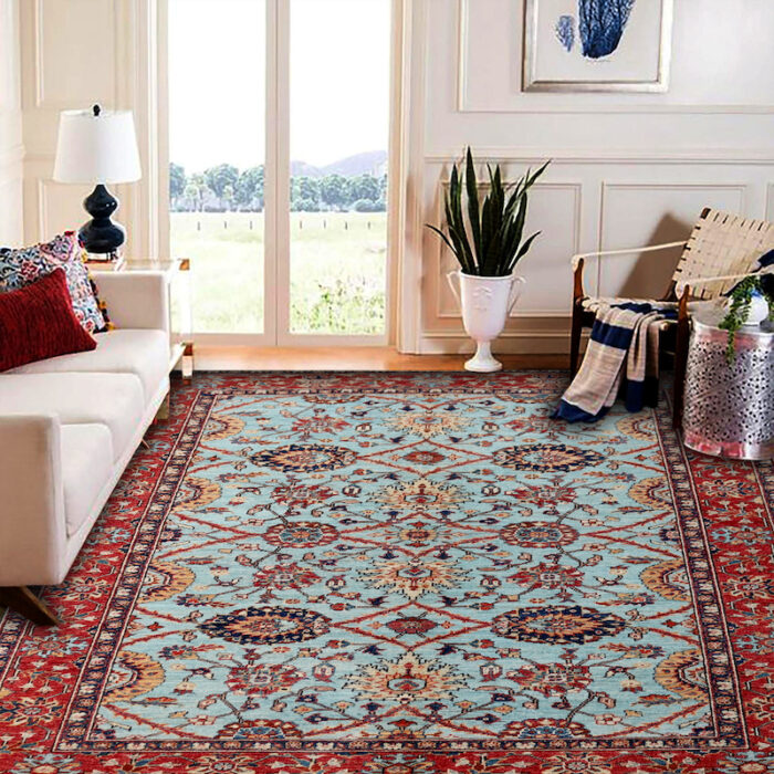 Handwoven wool rug with vintage Persian motifs, featuring navy, terracotta, and beige details