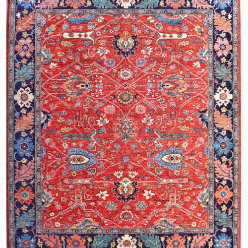 8x10 handwoven area rug with a vintage distressed look, showcasing floral and vine designs in rich, warm tones