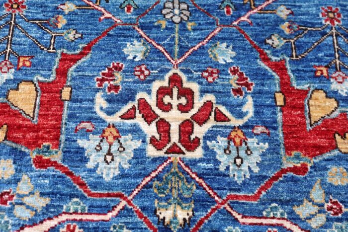 Elegant 8x10 blue and red area rug with ornate detailing, perfect for living rooms, dining spaces, and offices