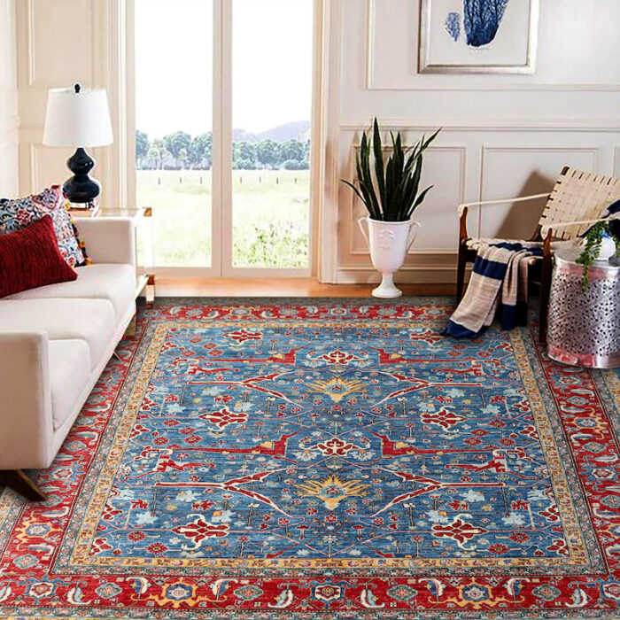 Luxury Persian-style rug with a distressed blue field and bold red border, ideal for classic and modern interiors