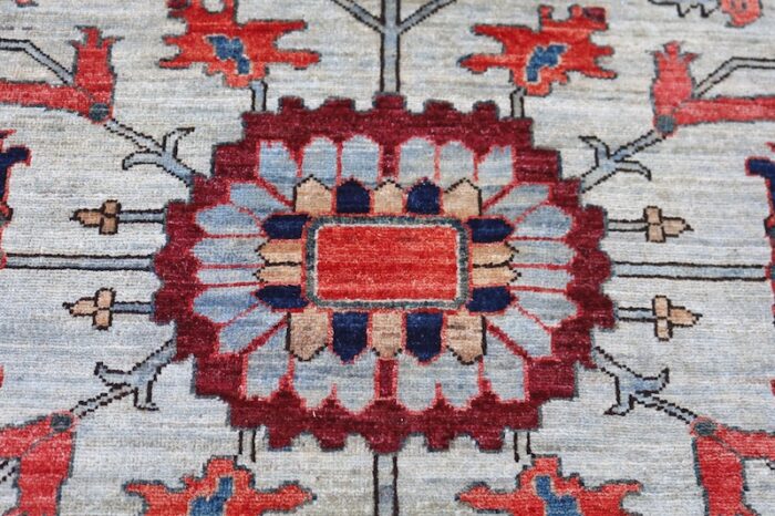 Traditional Serapi rug with burnt orange, ivory, and navy Persian-style patterns.