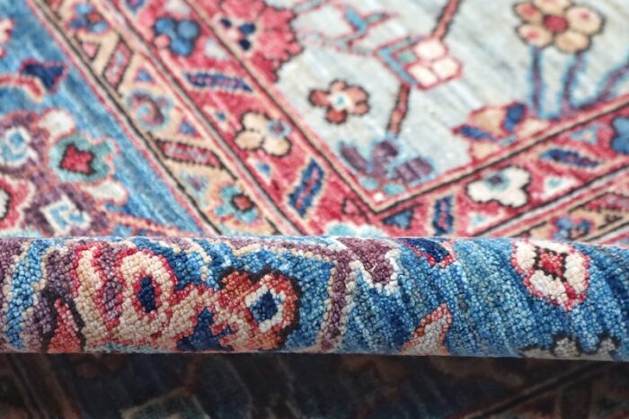 Traditional Tehran rug with deep red, sky blue, and navy Persian-inspired patterns.