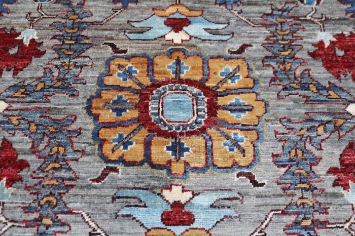 Traditional Persian Heriz rug 8x10 featuring bold geometric medallion and intricate floral motifs.