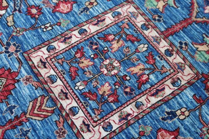 Traditional Heriz rug with red, navy, and ivory Persian floral patterns.