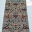 Handwoven 2.5x9.9 sky blue and rust Ziegler runner rug with intricate floral patterns.