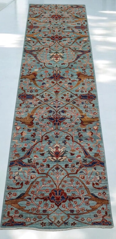 Handwoven 2.5x9.9 sky blue and rust Ziegler runner rug with intricate floral patterns.