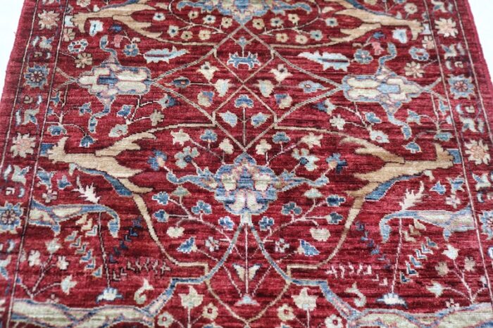 Traditional 2.6x24.7 Persian Ziegler runner rug in soft red, blue, and ivory.