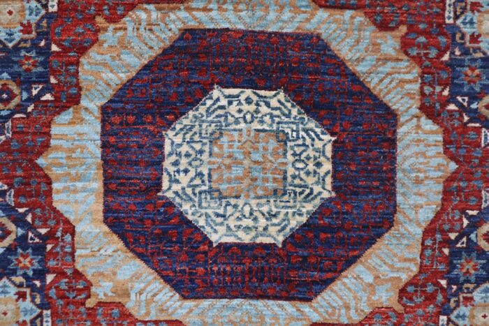 Handwoven 2.6x13 navy blue and rust red Mamluk runner rug with geometric medallion design.