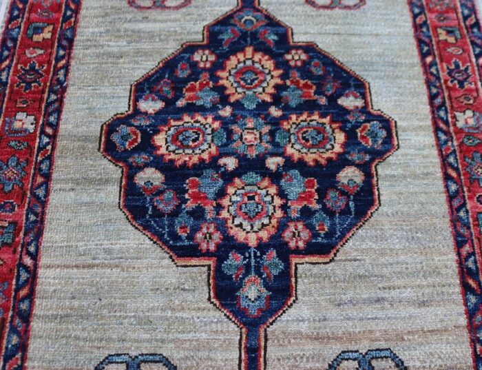 Handmade Persian Ziegler rug with a geometric medallion design, washable and durable