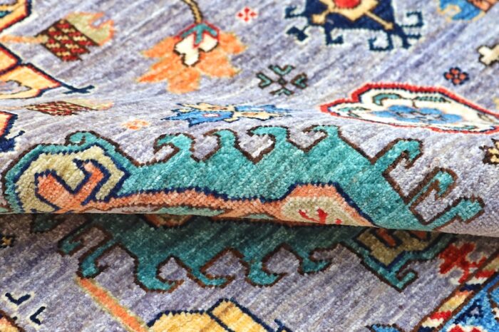 Authentic Kazak-style rug with intricate geometric motifs, handwoven with 100% wool and natural dyes