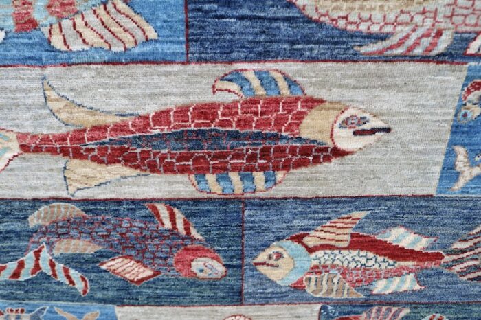 Unique fish pattern wool rug in blue and red hues, featuring intricate aquatic motifs, size 4'11 x 6'10."