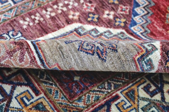 Durable handwoven 2.8 x 10 Kazak hallway runner rug in vibrant red, blue, and mustard – free USA shipping.