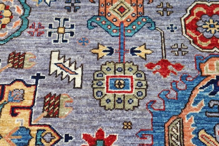 Luxury handmade wool area rug with a vibrant tribal design, ideal for modern and classic interiors