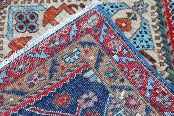 Geometric-patterned Persian Heriz rug, durable and competitively priced for modern and classic interiors.