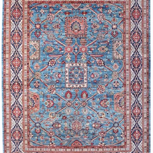 Hand-knotted Persian Heriz rug with vibrant colors and intricate borders.