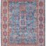 Hand-knotted Persian Heriz rug with vibrant colors and intricate borders.