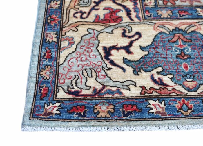 Luxury Oushak rug with Persian-inspired floral patterns and soft blue tones.