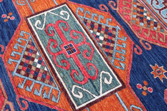 Authentic Kurdish rug in navy blue, red, and ivory, available in Berkeley & San Francisco.