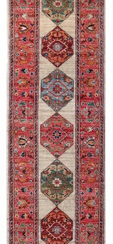 Red, blue, and ivory Persian Heriz runner rug with intricate border patterns