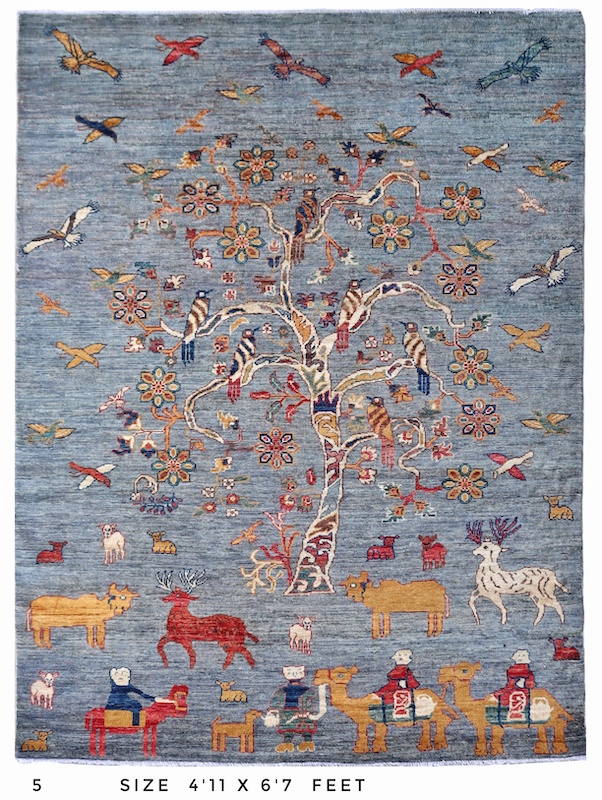 Beautifully woven Tree of Life rug with birds in flight, symbolizing harmony and freedom.