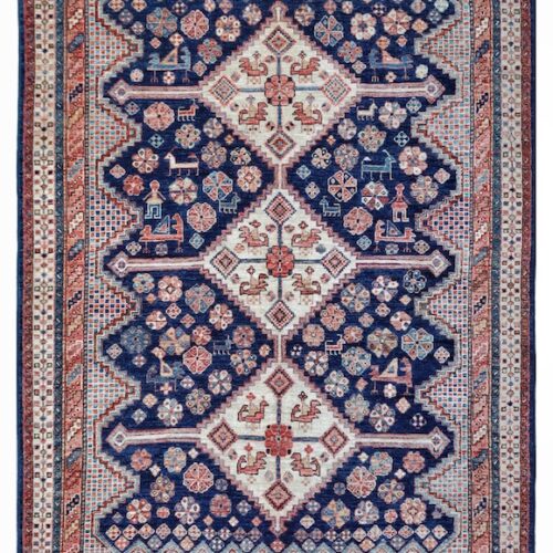 Handmade 5x7 Persian-style Shiraz rug with rich colors, bold medallions, and detailed borders