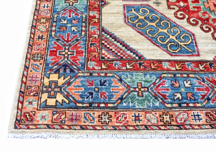 Persian-style 5x7 Kazak rug with a vibrant tribal design, perfect for entryways and living spaces.