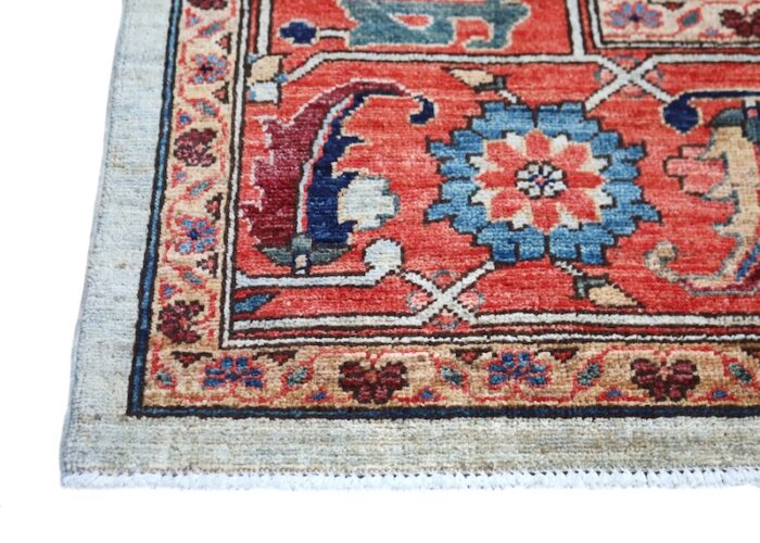 Elegant 9x12 Serapi rug with detailed floral borders and classic Persian motifs.