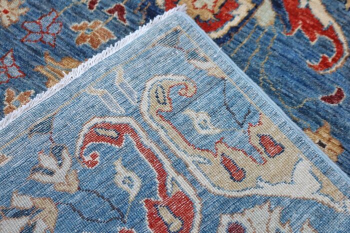 Hand-knotted Heriz rug with rich colors and intricate design, suitable for wall hanging.