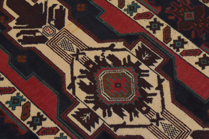 Geometric Afghan Baluch rug with rich red, black, and ivory tones. Soft, durable, and stain-resistant for high-traffic areas.