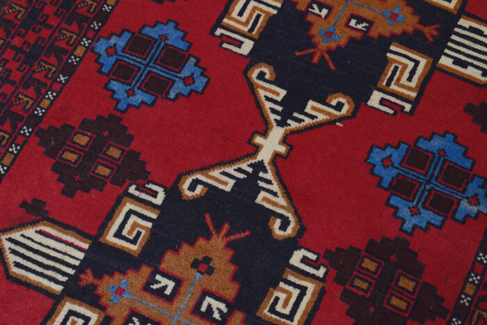 Traditional Afghan Baluch rug, 4'7 x 2'8 feet, featuring handcrafted tribal motifs. Washable and perfect for living rooms, bedrooms, and offices."