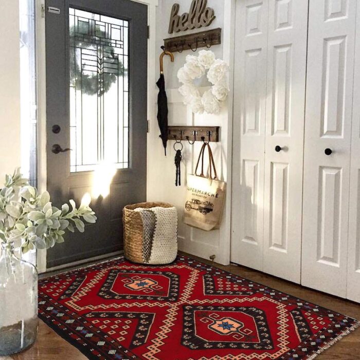 "Handwoven Afghan Baluch rug 4'6 x 2'10 ft in deep red with geometric diamond motifs. Available in San Francisco, Berkeley, and San Rafael