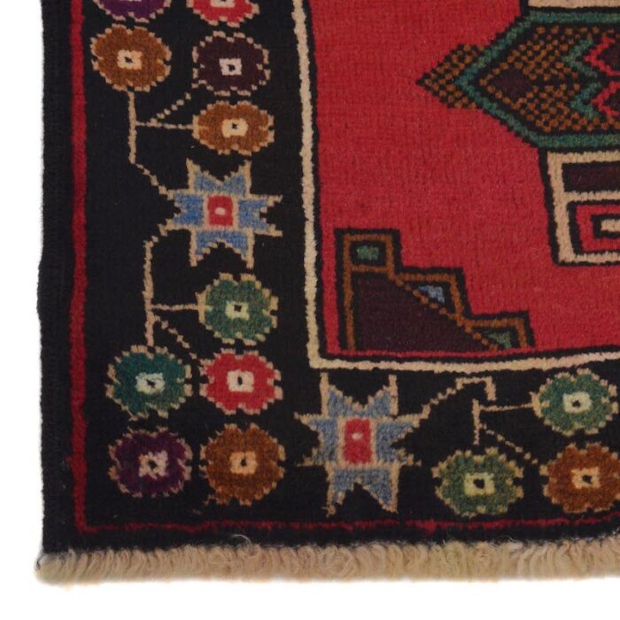 Handwoven Afghan Baluch rug 4'7 x 2'10 ft in bold red and deep brown with intricate geometric patterns. Available in San Francisco, Berkeley, and San Rafael