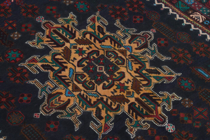 Handwoven Afghan Baluch rug 6'8 x 4'1 ft in deep black with rust and golden brown medallions. Available in San Francisco, Berkeley, and San Rafael