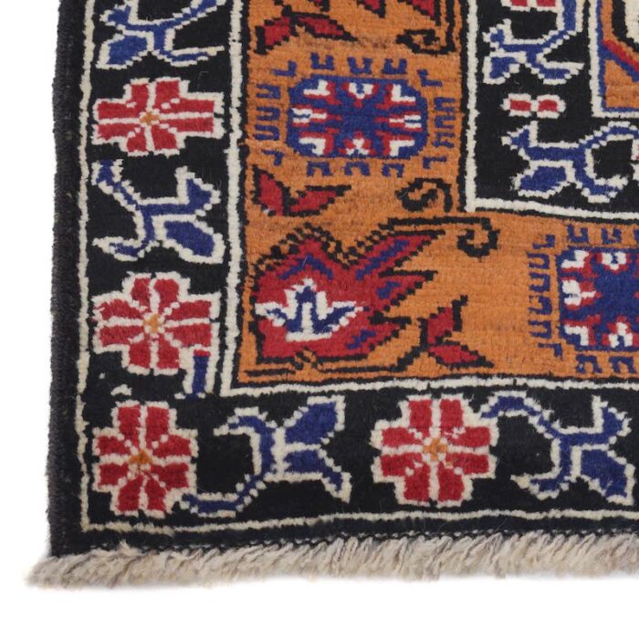 Authentic Afghan tribal wool rug featuring intricate geometric designs in rich blue and rust tones. Handmade by village artisans