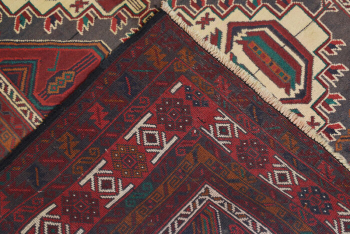 Authentic Afghan tribal rug in ivory, deep red, and teal with traditional medallion design, available in Ross, CA