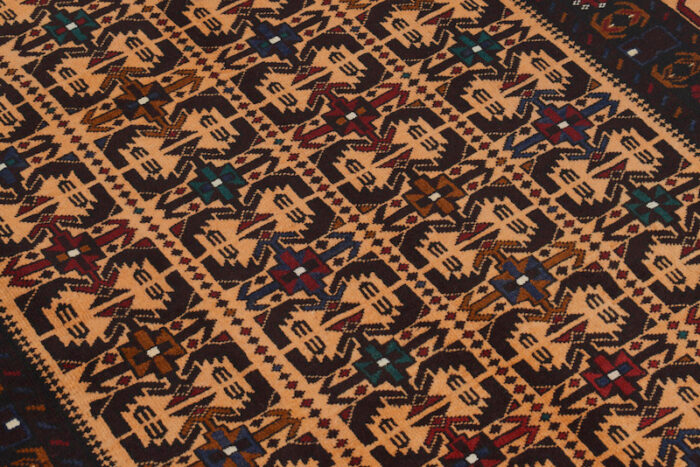 Vintage Baluchi rug 6'3 x 4'0 ft, crafted with a rich rust background and deep brown tribal motifs. Durable, washable, and available in Walnut Creek showrooms."