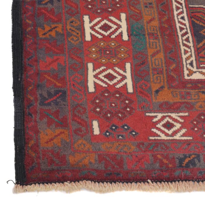 Geometric Afghan Baluch rug with a rich deep red background, black contrast, and golden brown accents. Soft, durable, and stain-resistant for high-traffic areas