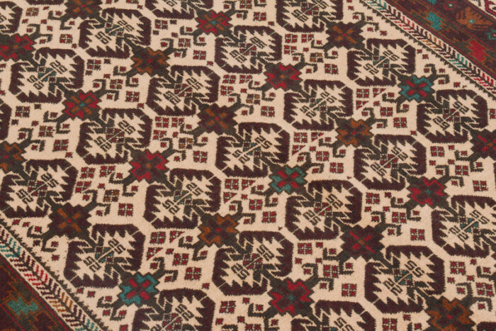 Geometric Afghan tribal rug with an ivory base and rich brown patterns. 6'4 x 4'0 ft, available in San Rafael and Berkeley showrooms.