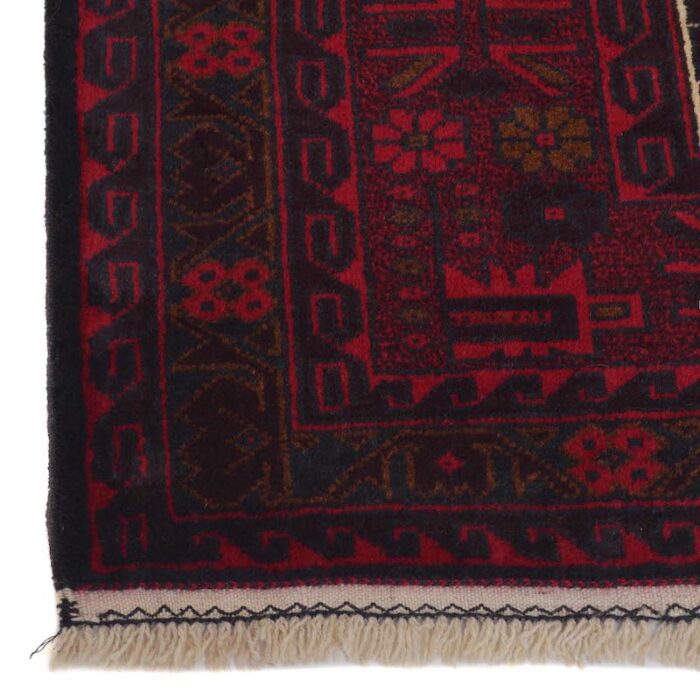 Traditional Baluchi rug, village-made and handwoven with deep red and cream tones. A durable, affordable, and washable wool rug for any home.