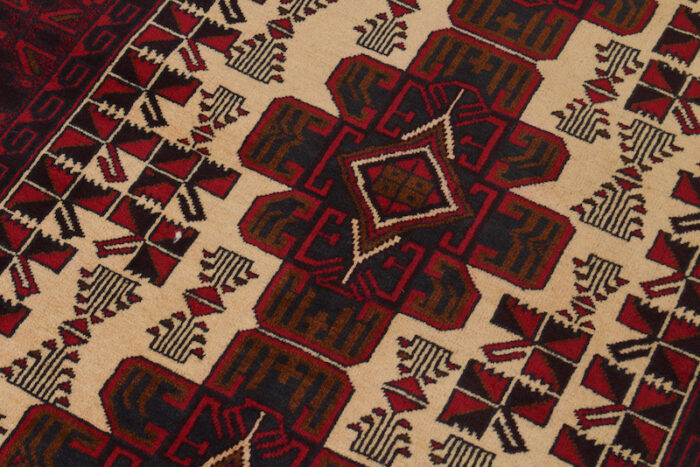 Authentic Afghan wool rug 6'7 x 4'3 ft with a striking contrast between deep red borders and an ivory geometric pattern. Perfect for high-traffic areas."