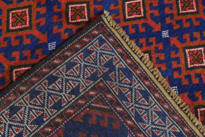 Vintage Baluchi rug 6'5 x 4'1 ft, handmade with bold tribal patterns in deep blue and red. Durable, washable, and ideal for any space."