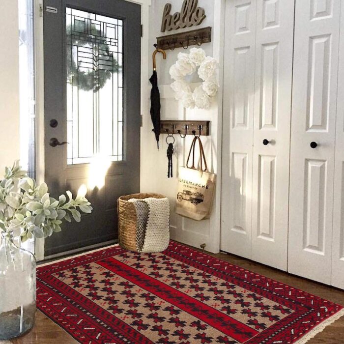 Traditional Baluch rug with intricate patterns in red, beige, and black. Handwoven, stain-resistant, and available in San Francisco, Berkeley, and San Rafael