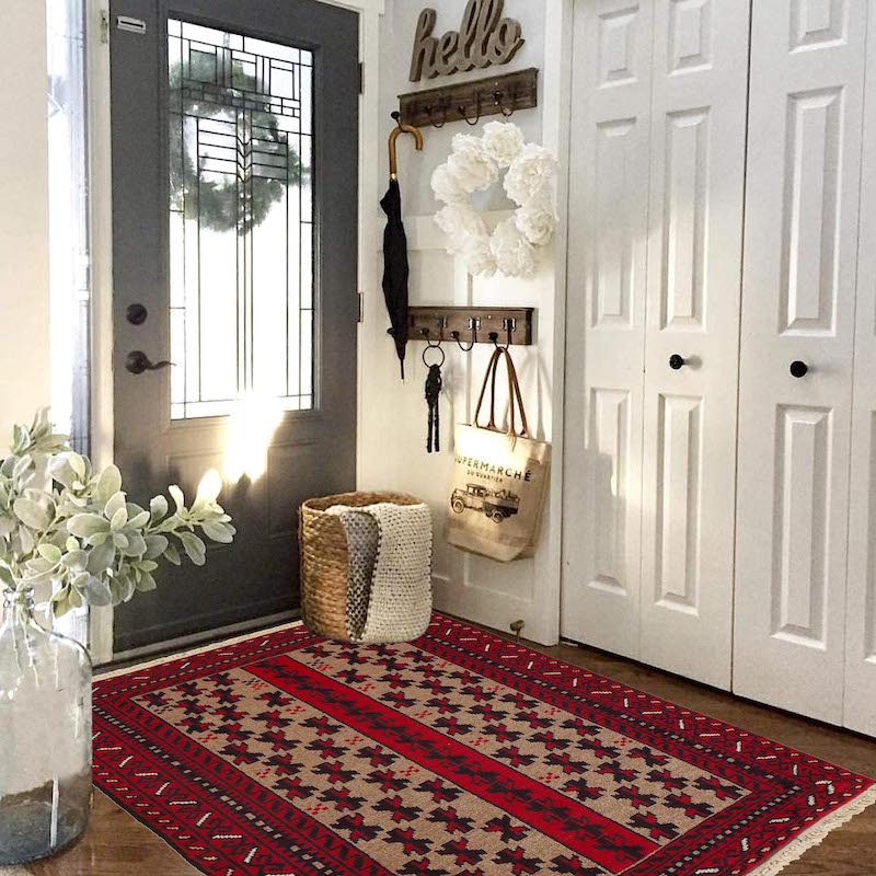 Traditional Baluch rug with intricate patterns in red, beige, and black. Handwoven, stain-resistant, and available in San Francisco, Berkeley, and San Rafael